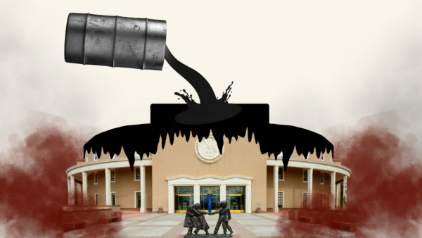 Oil barrel suspended above the Santa Fe Legislature Roundhouse, pouring crude oil over the top. An imagined situation/visual metaphor.