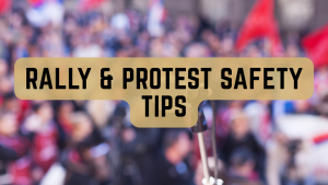 Photograph of a crowd at a rally, there is a large crowd but their faces are blurry and out of focus so they are not individually identifiable. There is black text box with gold background across the middle that says Rally and Protest Safety Tips.